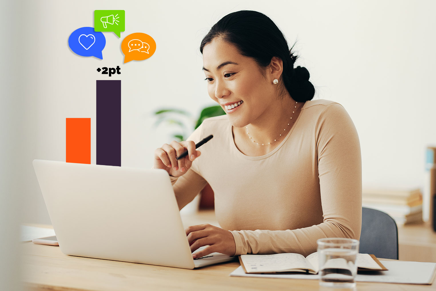Woman looking at her computer with bar graphs showing a lift in brand awareness